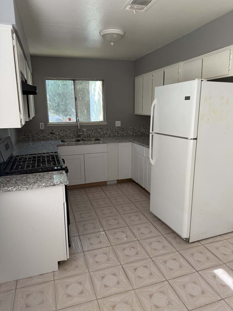 Kitchen with granite counters and gas range at 674 Gannet Ct